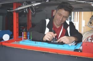 A technician working inside a Repair Not Replace van